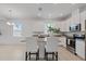 Bright, modern kitchen with stainless appliances, granite counters, and white cabinetry at 1050 Davis Heather Cir, Seffner, FL 33584