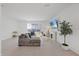 Comfortable living room with a large sectional, fireplace, and outdoor views at 1050 Davis Heather Cir, Seffner, FL 33584