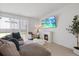 Bright living room with a modern fireplace and large sectional sofa at 1050 Davis Heather Cir, Seffner, FL 33584