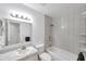 Bathroom with vanity, toilet, and shower-tub combo featuring tiled walls at 10709 Airview Dr, Tampa, FL 33625