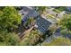 A bird's-eye view of the home reveals the deck, patio set, detached garage, and well-kept lawn at 108 S Lincoln Ave, Tampa, FL 33609