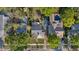 A bird's eye view shows a home with a patio set and a pool in the backyard, as well as mature landscaping at 108 S Lincoln Ave, Tampa, FL 33609