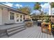 Backyard patio featuring a grill, outdoor furniture and manicured landscaping on a sunny day at 108 S Lincoln Ave, Tampa, FL 33609