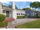Charming home with manicured landscaping and decorative stone accents enhancing curb appeal at 108 S Lincoln Ave, Tampa, FL 33609