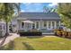 Charming single-Gathering home with a manicured front yard and exterior access from multiple rooms at 108 S Lincoln Ave, Tampa, FL 33609