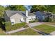 Beautiful single-Gathering home with an American flag waving, a chimney, and lovely manicured bushes at 108 S Lincoln Ave, Tampa, FL 33609
