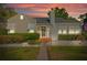 Charming single-Gathering home with a well-manicured lawn, brick walkway, and inviting entrance at 108 S Lincoln Ave, Tampa, FL 33609