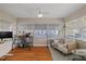 Cozy sunroom featuring hardwood floors, neutral tones, and ample natural light at 108 S Lincoln Ave, Tampa, FL 33609