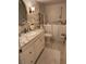 Cozy bathroom with a walk-in tub, vanity with granite countertop, and elegant decor for a spa-like feel at 1200 N Shore Ne Dr # 212, St Petersburg, FL 33701