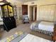 Comfortable bedroom featuring twin beds, a decorative hutch, and neutral walls, offering a cozy retreat at 1200 N Shore Ne Dr # 212, St Petersburg, FL 33701