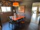 Charming dining room with a wooden table, elegant chairs, and decorative accents and natural light at 1200 N Shore Ne Dr # 212, St Petersburg, FL 33701