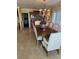 Charming dining room with rustic wood table, china cabinet, and neutral decor at 1200 N Shore Ne Dr # 212, St Petersburg, FL 33701