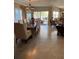 Spacious dining room with neutral decor and view of the outside balcony with ample seating at 1200 N Shore Ne Dr # 212, St Petersburg, FL 33701