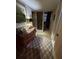 Hallway featuring an antique dresser with ornate decor and access to a room with plantation shutters at 1200 N Shore Ne Dr # 212, St Petersburg, FL 33701
