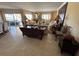Inviting living room boasts tile floors, sliding doors to the outside, and refined furnishings at 1200 N Shore Ne Dr # 212, St Petersburg, FL 33701