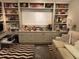Comfortable living room offers custom built-ins, a writing desk, and a comfortable sofa, creating a functional space at 1200 N Shore Ne Dr # 212, St Petersburg, FL 33701