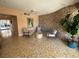 Inviting lobby featuring stone accent wall, tiled floors, stylish seating, and art at 1200 N Shore Ne Dr # 212, St Petersburg, FL 33701