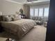 Relaxing main bedroom with a luxurious bed, plush pillows, a sitting area, and plenty of natural light at 1200 N Shore Ne Dr # 212, St Petersburg, FL 33701