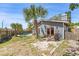 Beautiful backyard with sparkling pool, palm trees and wooden fence at 1366 Wexford N Dr, Palm Harbor, FL 34683