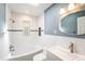 Modern bathroom with tiled walls, sleek vanity, and bathtub shower combo at 1366 Wexford N Dr, Palm Harbor, FL 34683