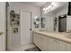 Bright bathroom with a vanity, mirror, and tiled floor at 14130 Rosemary Ln # 1201, Largo, FL 33774