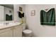 Bathroom with a vanity, mirror, and decorative touches at 14130 Rosemary Ln # 1201, Largo, FL 33774