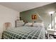 Relaxing bedroom with a soft, inviting bed and a soothing paint color at 14130 Rosemary Ln # 1201, Largo, FL 33774