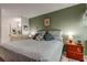 Well-lit bedroom with neutral tones, a queen bed, and coordinating furniture at 14130 Rosemary Ln # 1201, Largo, FL 33774