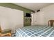 This is a cozy bedroom with a double bed and convenient closet space at 14130 Rosemary Ln # 1201, Largo, FL 33774