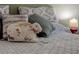 Close-up of a cozy bedroom with a decorative bunny and soft, patterned bedding at 14130 Rosemary Ln # 1201, Largo, FL 33774