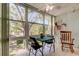Cozy Florida room with large windows, perfect for relaxing and enjoying the natural light at 14130 Rosemary Ln # 1201, Largo, FL 33774