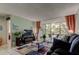 Cozy living room with a large window, nice tile floors, and comfortable seating at 14130 Rosemary Ln # 1201, Largo, FL 33774