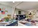 Open-concept living area with an inviting sofa, neutral walls, and a seamless flow to the dining area at 14130 Rosemary Ln # 1201, Largo, FL 33774