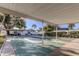Community shuffleboard court featuring shaded seating areas and well-maintained courts at 14130 Rosemary Ln # 1201, Largo, FL 33774