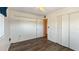 The bedroom has wood floors, a built-in closet, and access to the hallway at 1515 Arrowhead Dr, Sun City Center, FL 33573