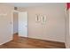 This bedroom features wood floors and an open doorway at 1515 Arrowhead Dr, Sun City Center, FL 33573