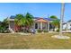 Charming single-story home with mature landscaping, solar panels and a welcoming front porch at 1515 Arrowhead Dr, Sun City Center, FL 33573