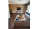 Cozy living room with modern furniture, a large window, and stylish decor at 1515 Arrowhead Dr, Sun City Center, FL 33573