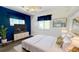Serene main bedroom with a plush bed, stylish decor, and ample natural light at 1515 Arrowhead Dr, Sun City Center, FL 33573
