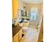 Hall bathroom featuring white vanity, cabinets, nautical décor, and neutral walls at 1516 Arrowhead Dr, Sun City Center, FL 33573