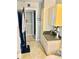 Hall bathroom featuring white vanity, cabinets, and nautical décor at 1516 Arrowhead Dr, Sun City Center, FL 33573