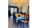 Formal dining room featuring a chandelier, elegant table setting, and stylish decor at 1516 Arrowhead Dr, Sun City Center, FL 33573