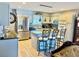 Modern kitchen with stainless steel appliances, a breakfast bar, and stylish pendant lighting at 1516 Arrowhead Dr, Sun City Center, FL 33573