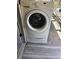 White washing machine with a front-load design, offering efficient laundry capabilities at 1516 Arrowhead Dr, Sun City Center, FL 33573