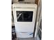 Modern white dryer with a front-load design and glass door, offering efficient laundry capabilities at 1516 Arrowhead Dr, Sun City Center, FL 33573