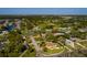 Aerial shot of the home shows its location in a residential area near a park and waterways at 1591 N Dakota Ne Ave, St Petersburg, FL 33703