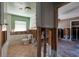 Partially renovated bathroom with tiled floors and a toilet with wall and floor damage at 1591 N Dakota Ne Ave, St Petersburg, FL 33703