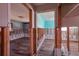 View of 2 bedrooms with wood floors, exposed framing, and evidence of ongoing renovations at 1591 N Dakota Ne Ave, St Petersburg, FL 33703