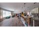 Spacious living room undergoing renovations featuring wood-look floors, exposed framing and open layout at 1591 N Dakota Ne Ave, St Petersburg, FL 33703