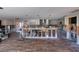 Spacious open floorplan under renovation with wood flooring, partial framing, and open kitchen area at 1591 N Dakota Ne Ave, St Petersburg, FL 33703